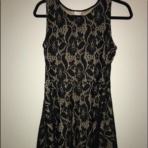 black and cream colored laced dress